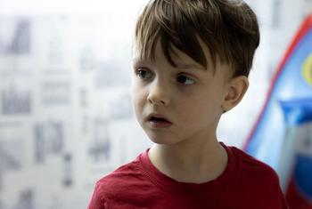 Five-year-old Arthur from Mariupol, Ukraine, still bears scars after surviving hunger and the bombing of his home city.