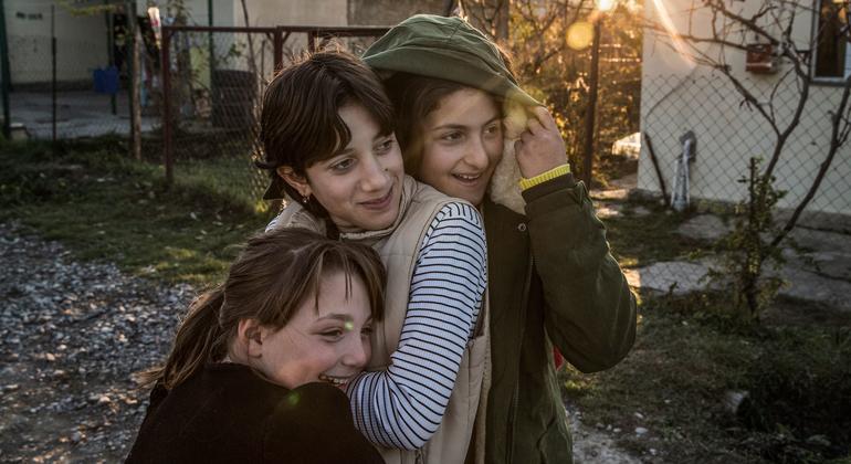 Three young women displaced by the 2008 conflict in the Republic of Georgia stand outside a psychosocial support centre in an IDP settlement in Shavshvebi.