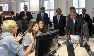 UN Secretary-General António Guterres (right) interacts with students of ReDi School for Digital Integration in Berlin,  Germany.