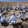 Young Afghans join hands as they embark upon a demonstration of peace in Bamyan, Afghanistan.