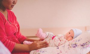 A mother tends to her baby at a women's centre in Aktau City, Kazakhstan.