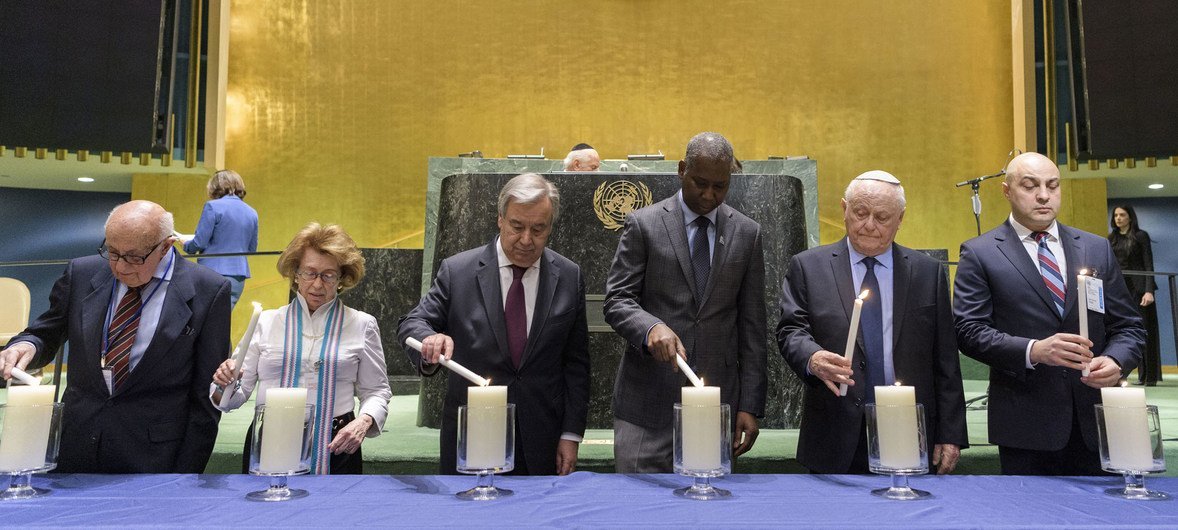 A candle lighting ceremony takes place at the United Nations Holocaust Memorial Ceremony 