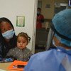 A mother and child at a hospital in Colombia during the COVID-19 pandemic.