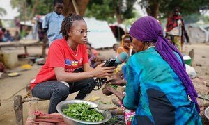 Central African reporter Merveille Noella Mada-Yayoro reporting on conditions at Birao IDP camp. for Guira FM, the UN peace mission's radio in CAR.