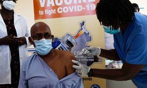 Man get COVID-19 vaccination in South Sudan.