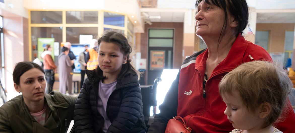 Ukrainian refugees arrive at Rzeszow train station in Poland after fleeing Ukraine.