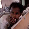 Man with AIDS being cared for in a hospital in India. 