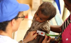 A child undergoes a malnutrition test in Madagascar.