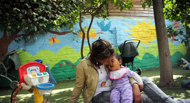 Mother kisses her daughter at the Catalina Home in Santiago, Chile.