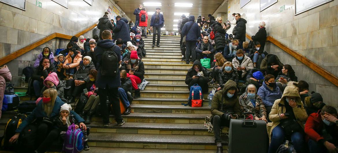 On 24 February 2022, people take shelter in a subway station during ongoing military operations in Kyiv, Ukraine.