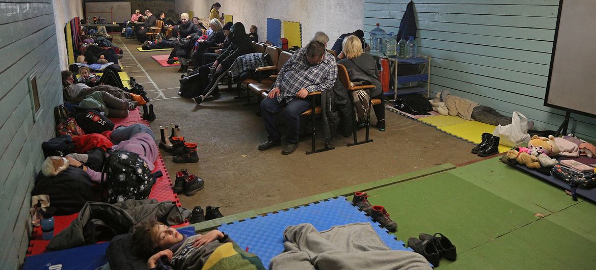 On February 25, 2022, people take shelter in a school during ongoing military operations in Kyiv, Ukraine.