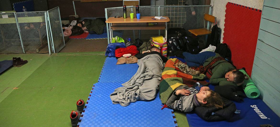 On 25 February 2022, people shelter in a school during ongoing military operations in Kyiv, Ukraine.