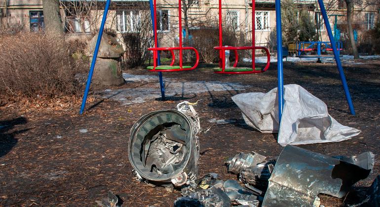 On 25 February 2022, spent pieces of a rocket lie next to a playground, with military operations ongoing in Kyiv, Ukraine.