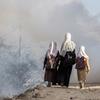 Three sisters walk to their school close to a fighting zone in Taizz, Yemen, February 2021.