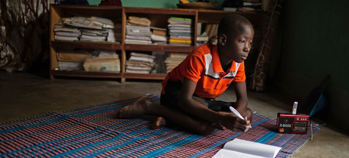 A young boy studies at home in Dori, Burkina Faso.