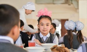 A 9-year-old girl eats lunch at a primary school in Turkestan city, Kazakhstan.  