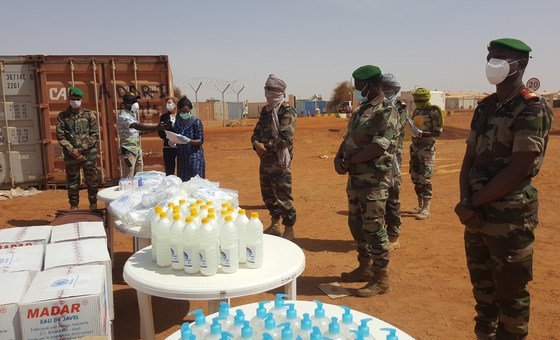 UNAMI personnel distrubute COVID-19 prevention kits  in Gao, Mali.