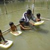 Children in Bangladesh are taught how to swim. 
