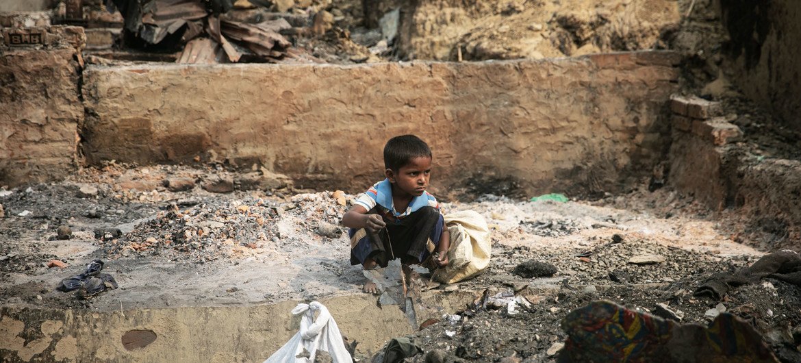 A child rummages through debris after a massive fire devastated the Balukhali area of the Rohingya refugee camps in Cox’s Bazar.