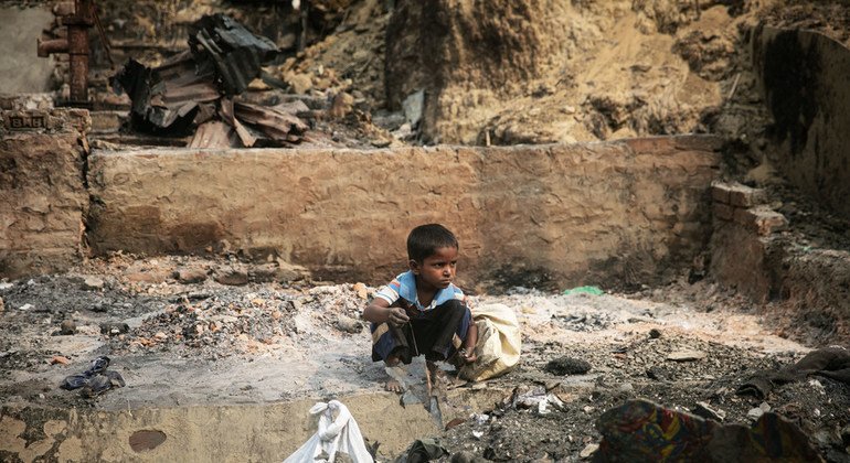 A child rummages through debris after a massive fire devastated the Balukhali area of the Rohingya refugee camps in Cox’s Bazar.