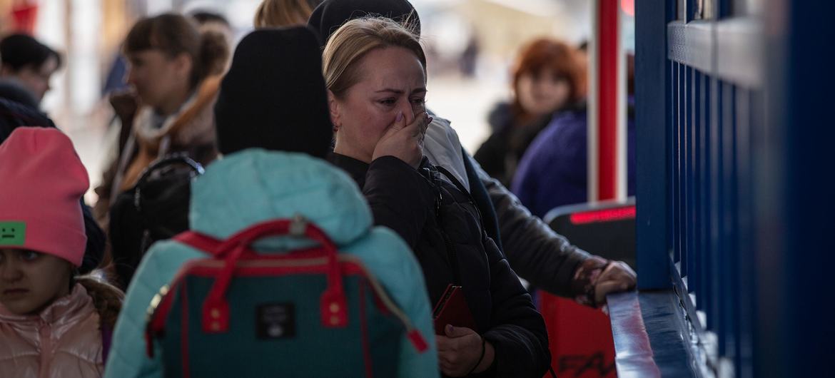 At the border crossing between Ukraine and Moldova at Palanca, refugees stand in line