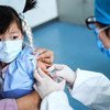 A 3-year-old girl receives a vaccine shot at a community health centre in Beijing, China, on 26 March 2020.