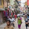 People walk down a street of shops in Kathmandu, Nepal. (file)
