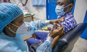 A UN staff member in Benin receives the COVID-19 vaccine in the capital Cotonou.