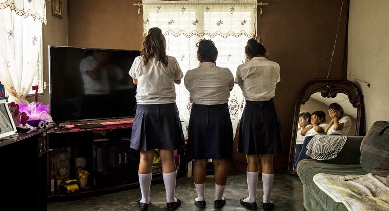 While walking home from school in Yoro, Honduras, the 13-year-old girl in the middle was grabbed, thrown into a van, beaten, raped and released one hour later. 