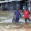 Children walk in flood waters in Jonglei state, South Sudan.