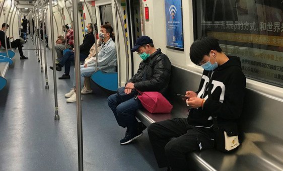 Passengers wear face masks while riding the subway in Shenzhen, China.