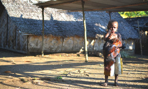 A young boy holds a chicken in Taremb, Malekula Island, Vanuatu.