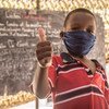 An eight-year-old child  in Nouakchott, Mauritania, gives a thumbs-up after an awareness session on preventing COVID-19.