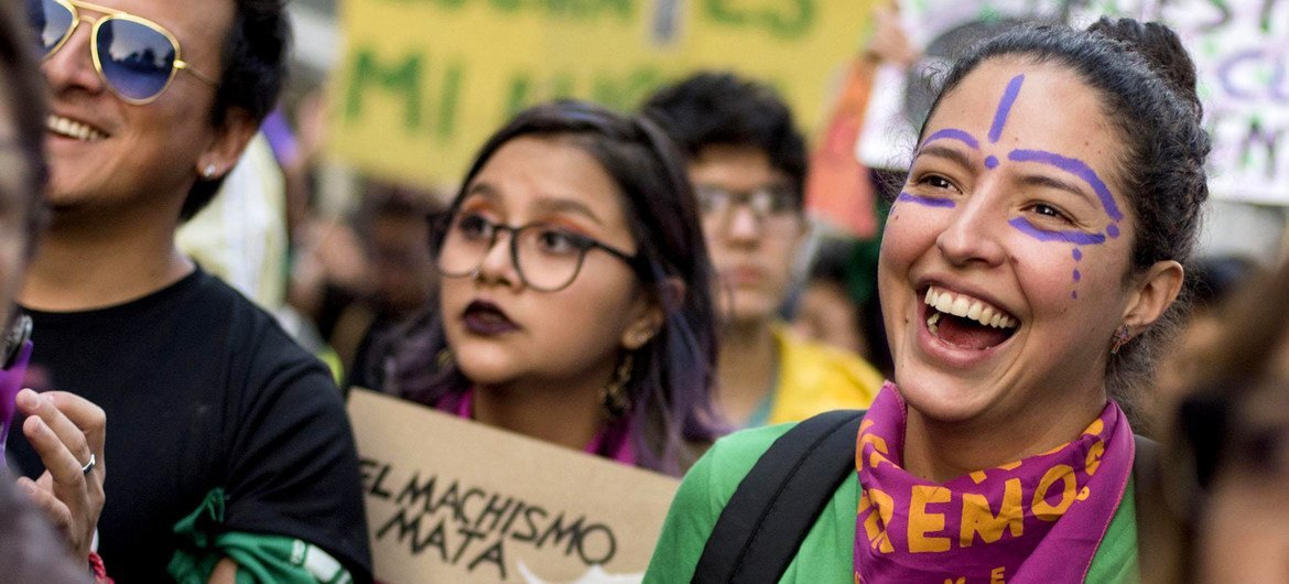 People protest in a demonstration for women's rights in Ecuador.