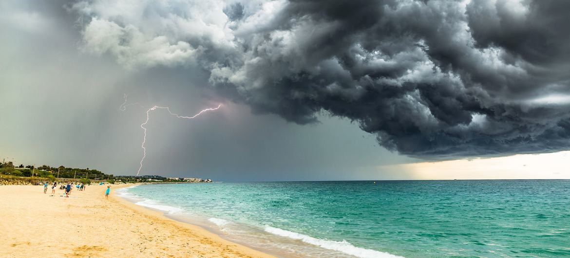 A storm gathers over a beach in Barcelona, Spain.
