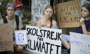 The Swedish teenage climate activist, Greta Thunberg (centre), joins other young people for a school strike or demonstration outside the United Nations in New York on 30 August 2019.