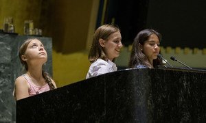 Greta Thunberg (l) joins two other teenage climate activists in the UN General Assembly Hall in New York on 30 August 2019. 