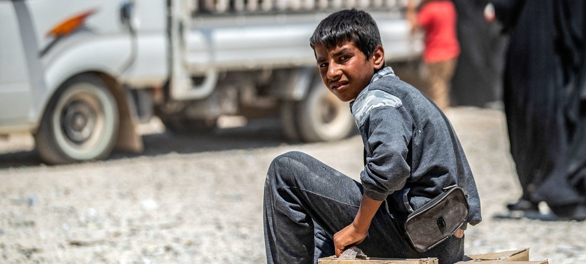 A young boy photographed at Al-Hol refugee camp in the northeastern desert of Syria. (July 2019)