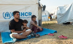A 33-year-old man from Afghanistan, pictured with his family on the Greek island of Lesvos, is hoping to be relocated to Germany.