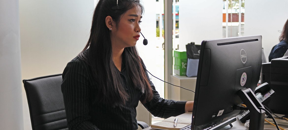 Naiyapak Chaipan at her working station at the 1300 Hotline Centre, where she answers calls from women at risk.