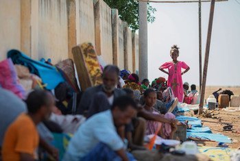 Refugees from Ethiopia sit in the shade to avoid the hot afternoon sun at the Hamdayet Border Reception Centre in eastern Sudan.