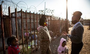 A teenage activist speaks with a young girl in an informal settlement on the outskirts of Johannesburg, South Africa (file photo).