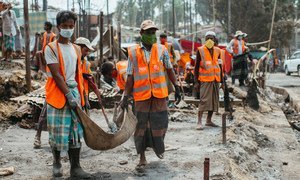 Rohingya volunteers clear debris to reconstruct shelters after the devastating fire at the Kutupalong refugee camp, in Cox’s Bazar, Bangladesh.  