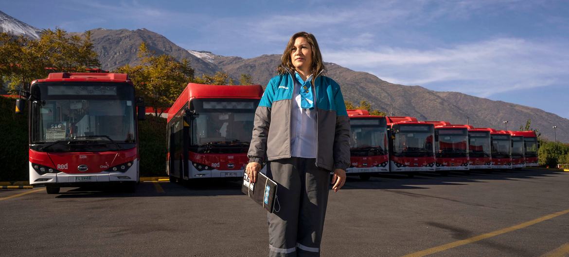 A worker at an electric bus charging terminal in Santiago, Chile.