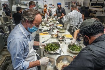 UN officials and ambassadors cook a sustainable meal, at the Brownsville Community Culinary Centre, at an event to raise awareness of food waste