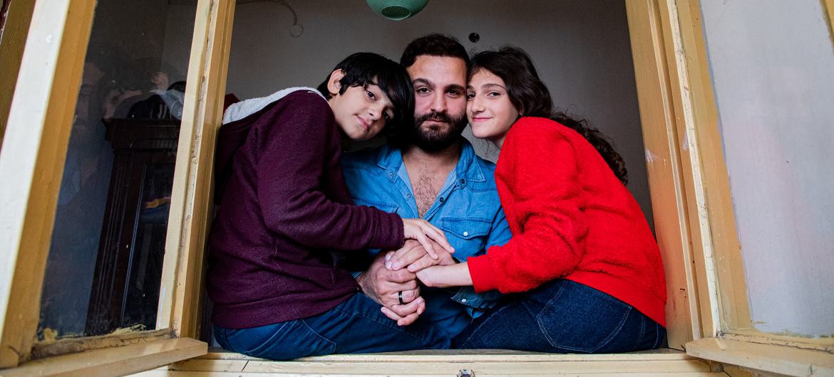 Leyla with her twelve-year-old lad   and thirteen-year-old daughter. 