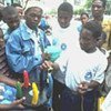 Condom use demonstration in Mozambique. (UNAIDS)