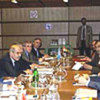 Kofi Annan (2nd left) at UN-Iraq talks in Vienna