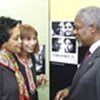 Kofi Annan with UN Guides, looks on at photo exhibit
