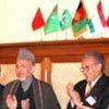 President Karzai and Amb. Brahimi applaud signing of declaration
